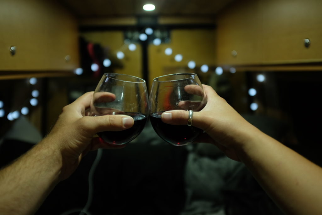 drinking wine in sprinter camper van